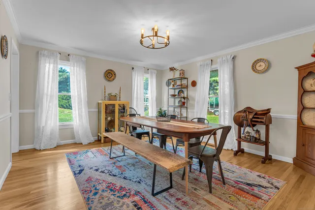 a workspace with furniture window and wooden floor