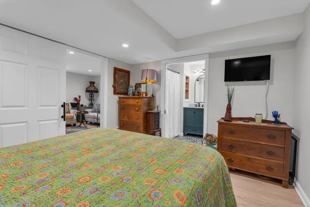 a en suite bathroom with a sink and a mirror