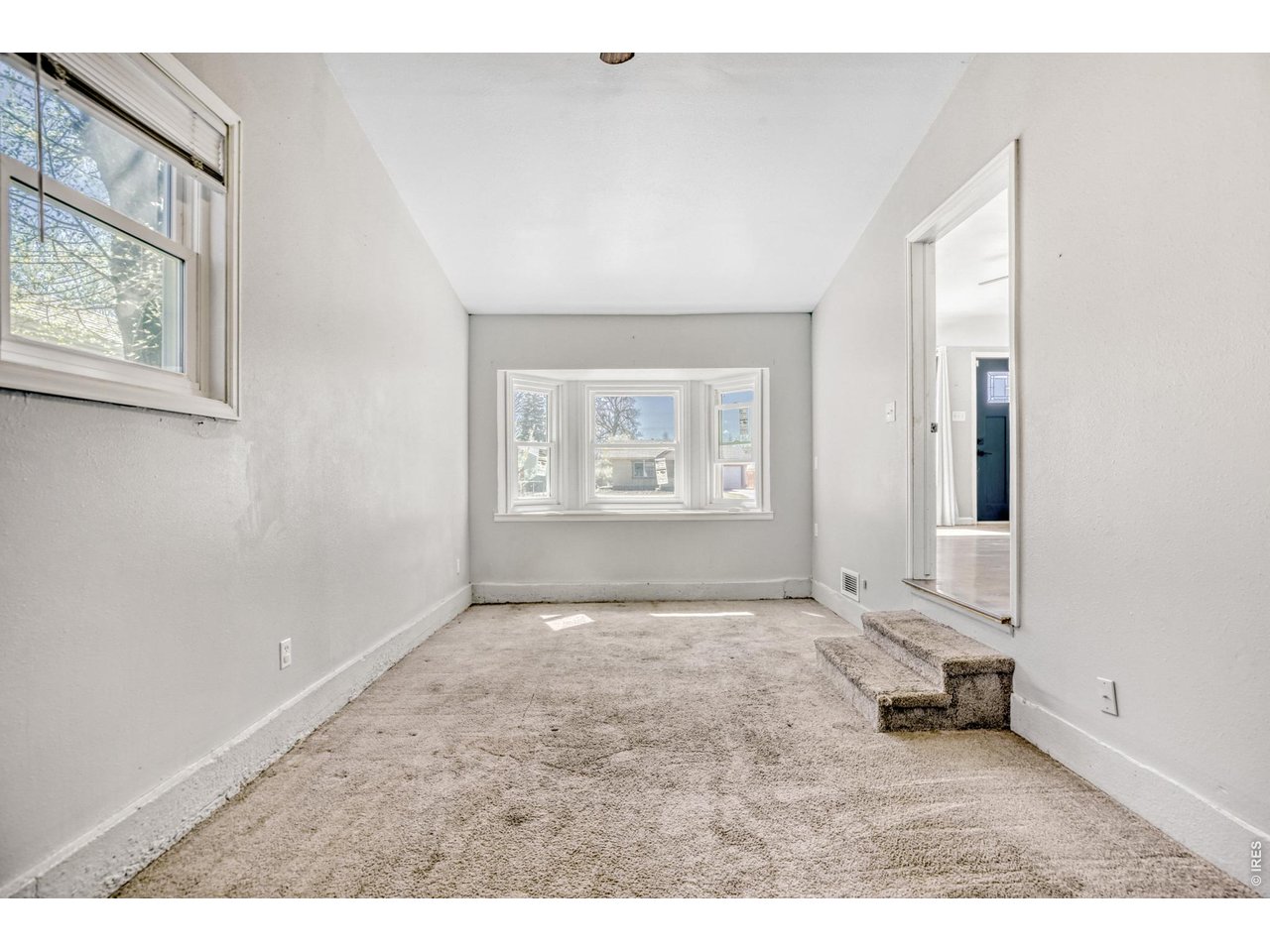 1807 7th Street Greeley, CO 80631 - Photo 12 of 17 an empty room with windows and closet