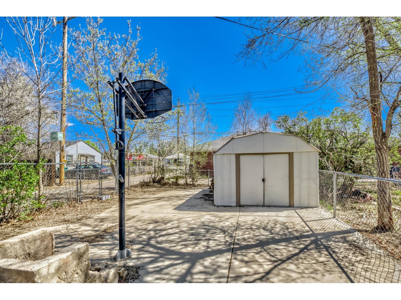 1807 7th Street Greeley, CO 80631 - Photo 15 of 17 a view of a house with wooden fence