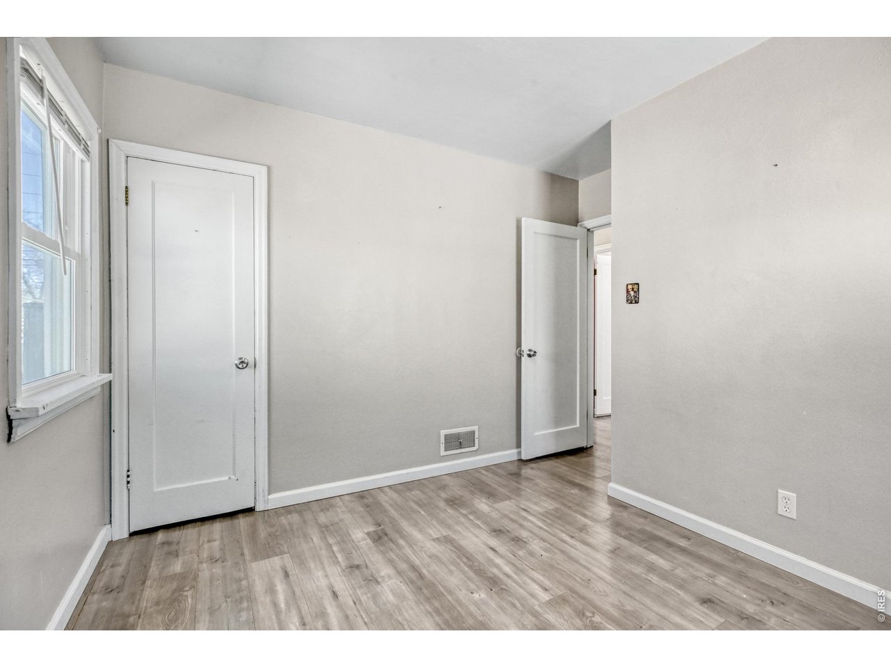 1807 7th Street Greeley, CO 80631 - Photo 6 of 17 a view of an empty room with wooden floor