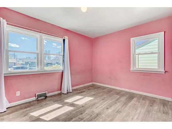 an empty room with windows