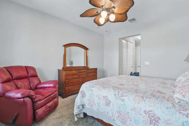 a view of walk in closet with clothes