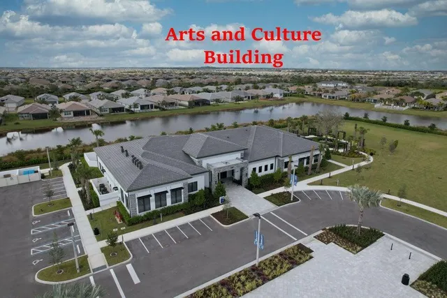 a large living room with stainless steel appliances granite countertop furniture a couch and a large window