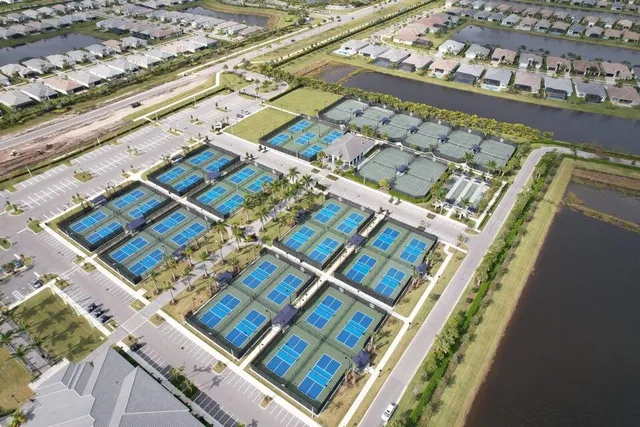 a view of a patio with table and chairs under an umbrella