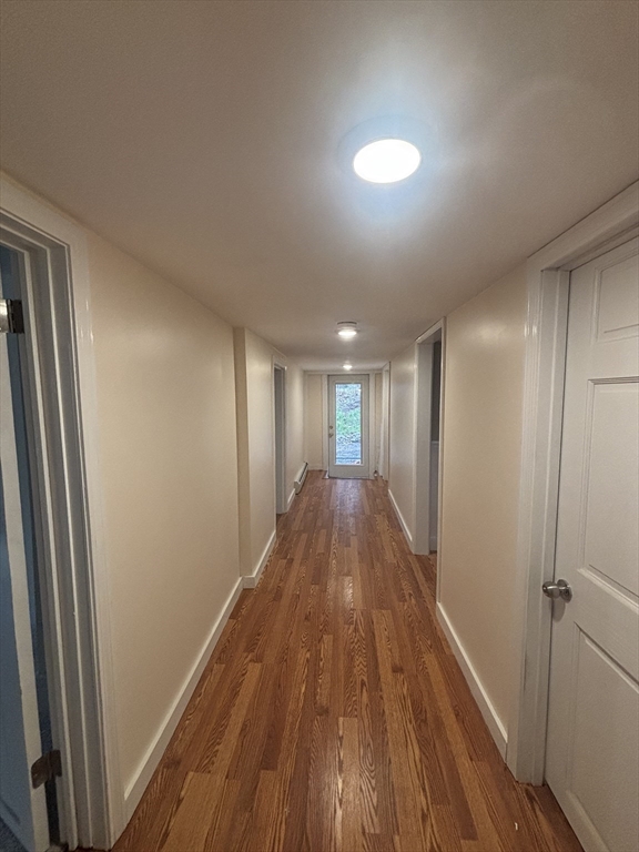 11 Williams Street Dudley, MA 01571 - Photo 14 of 16 a view of hallway with wooden floor
