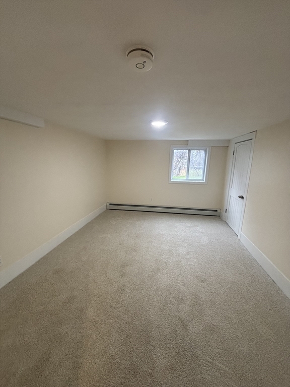 11 Williams Street Dudley, MA 01571 - Photo 16 of 16 a view of an empty room with a window