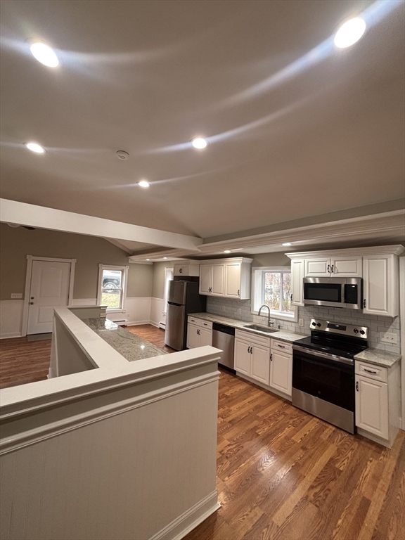 11 Williams Street Dudley, MA 01571 - Photo 5 of 16 a kitchen with stainless steel appliances granite countertop a sink dishwasher stove top oven and refrigerator