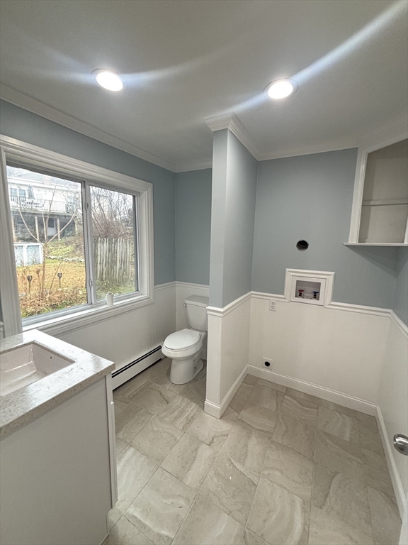 11 Williams Street Dudley, MA 01571 - Photo 7 of 16 a room with a window and a potted plant