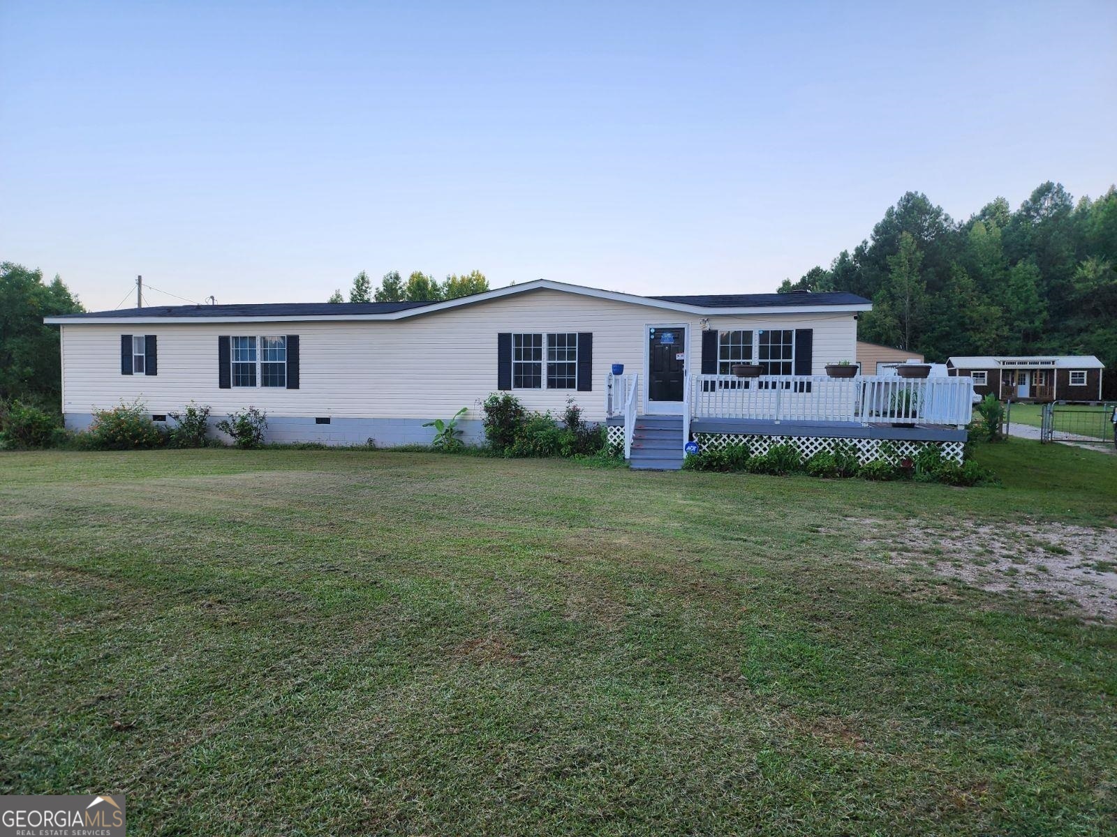 215 Rebon Maddox Road Jackson, GA 30233 - Photo 1 of 1 a front view of house with yard and green space