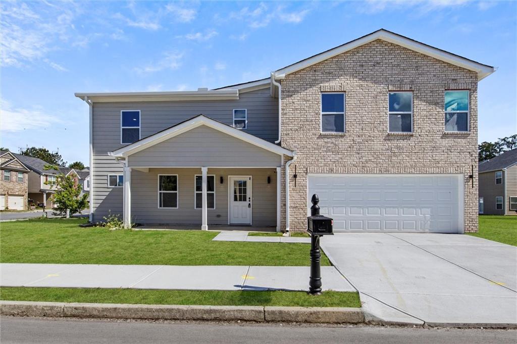 a front view of a house with a yard