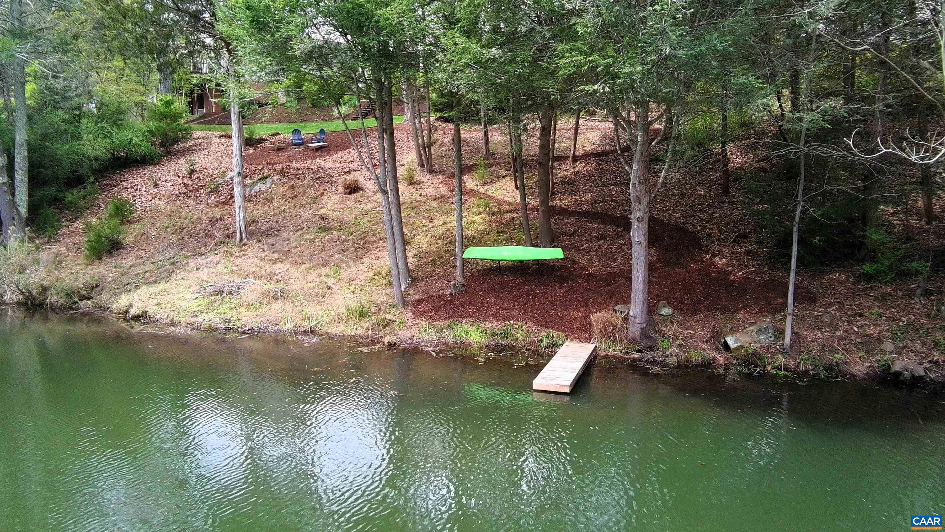 257 Starcrest Road Charlottesville, VA 22902 - Photo 13 of 65 a view of a lake with a house