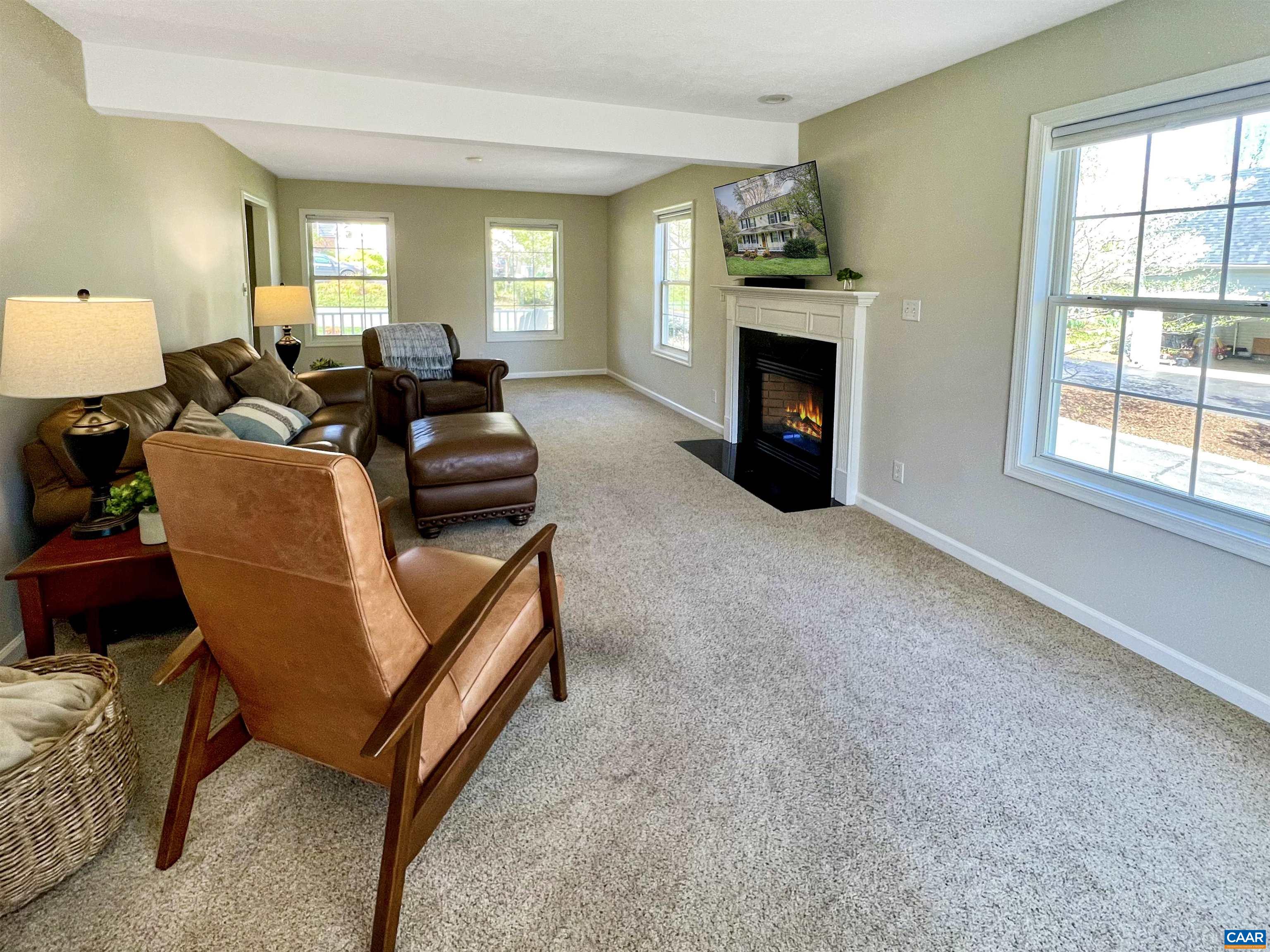 257 Starcrest Road Charlottesville, VA 22902 - Photo 23 of 65 a living room with furniture a fireplace and a window