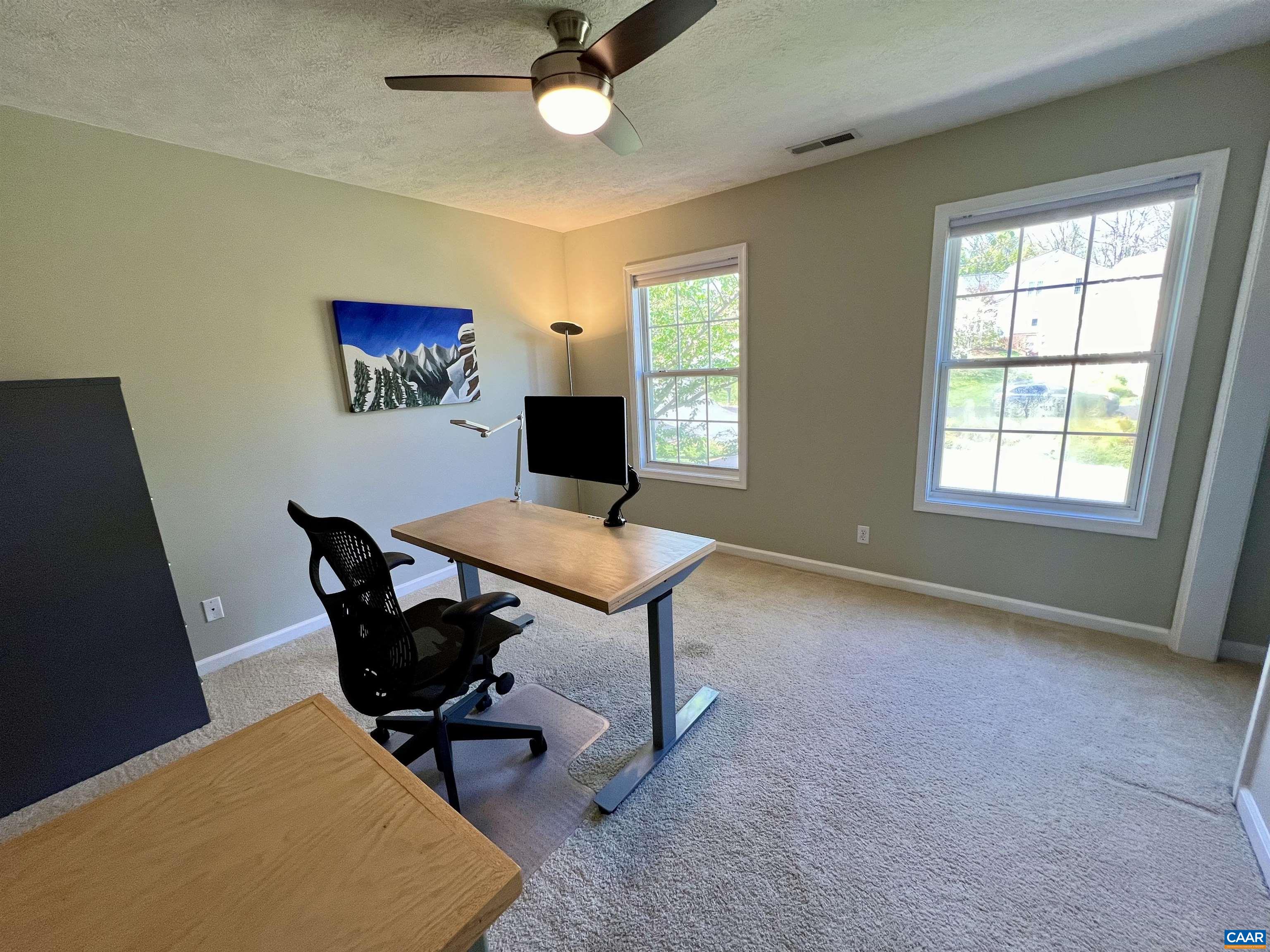 257 Starcrest Road Charlottesville, VA 22902 - Photo 36 of 65 a view of a workspace with furniture and a window