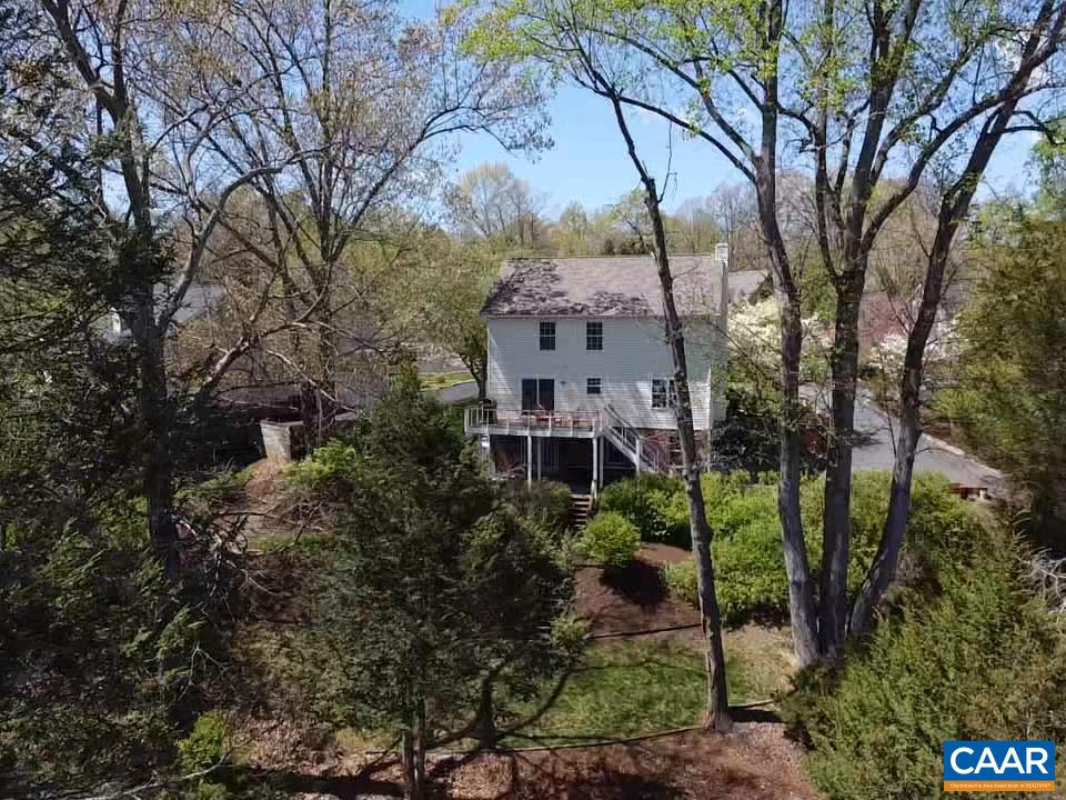 257 Starcrest Road Charlottesville, VA 22902 - Photo 46 of 65 a aerial view of a house with a yard and large trees