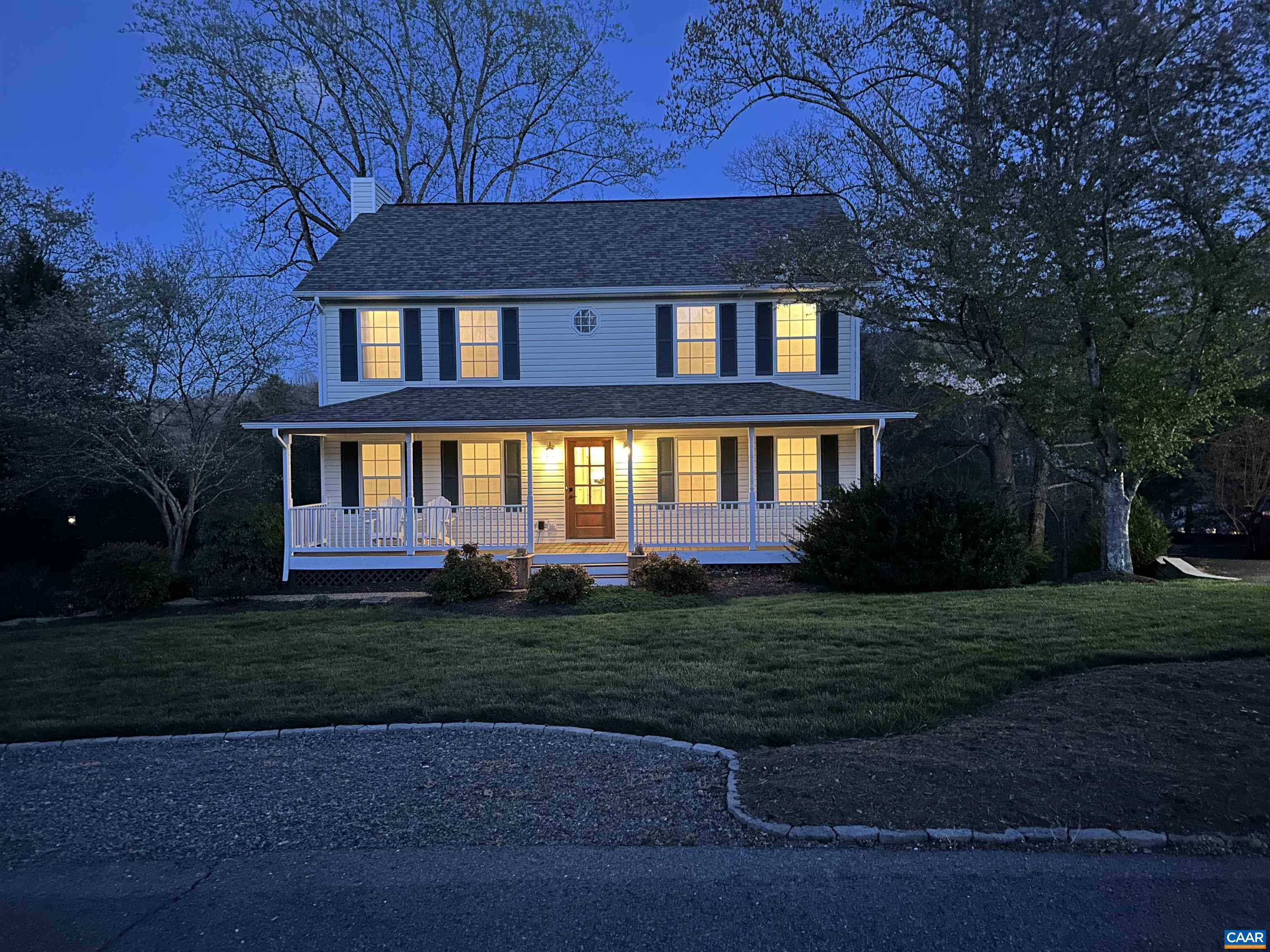 257 Starcrest Road Charlottesville, VA 22902 - Photo 64 of 65 a view of a brick house next to a yard with big trees