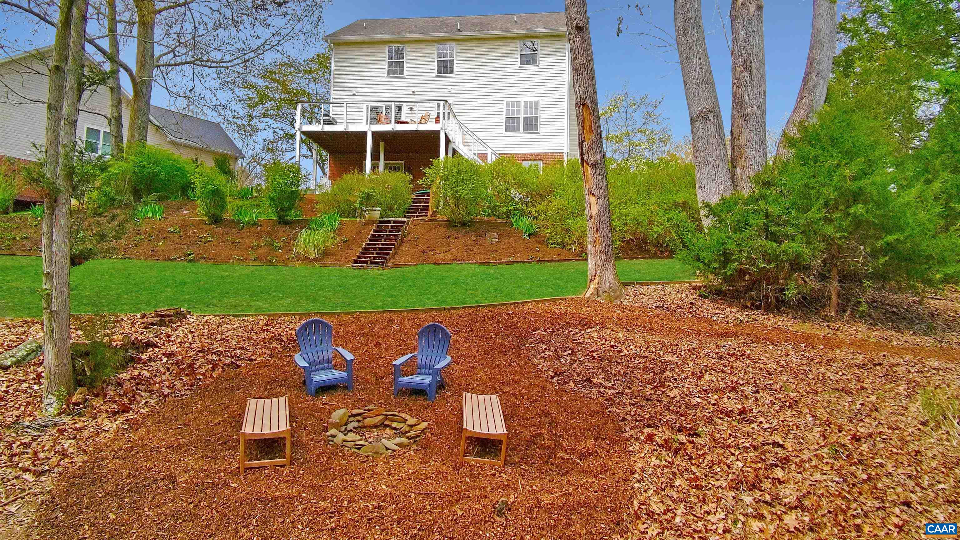 257 Starcrest Road Charlottesville, VA 22902 - Photo 8 of 65 a view of a chair and table in backyard of the house
