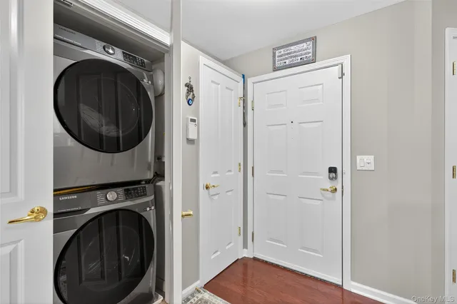 a view of a hallway with washer and dryer
