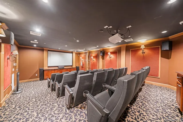 a living room with furniture a ceiling fan and a rug
