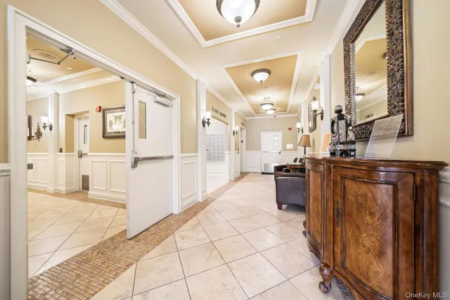 a kitchen with stainless steel appliances kitchen island granite countertop a refrigerator and a sink