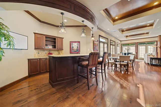 a view of kitchen with cabinets and wooden floor