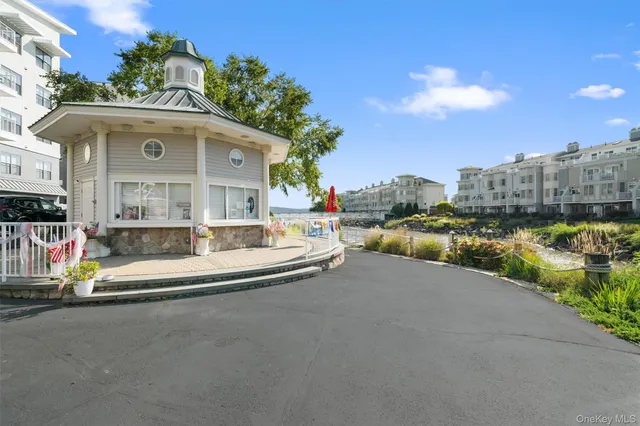 a front view of a house with a yard and entertaining space
