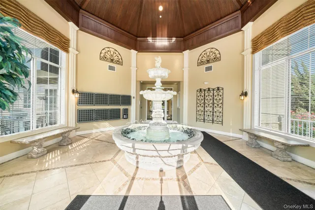 a dining room with a large window and table