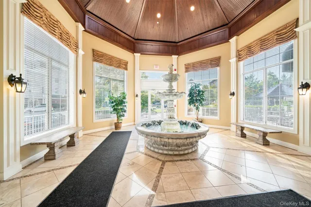 a living room with couch and a large window