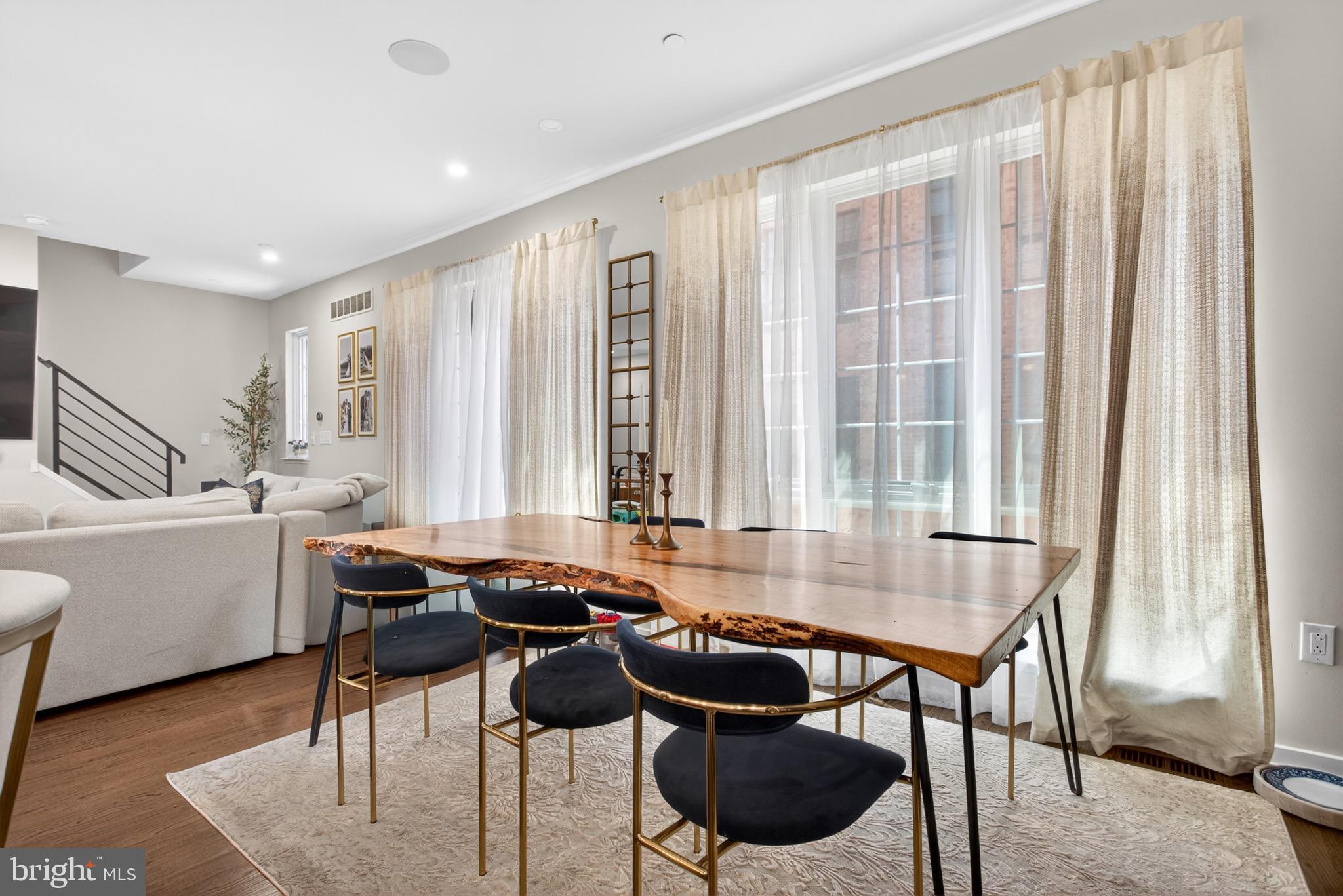 2411 Innovator Way Philadelphia, PA 19146 - Photo 11 of 26 a dining room with furniture and large windows