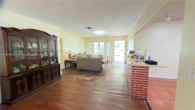 a bedroom with furniture and a gate