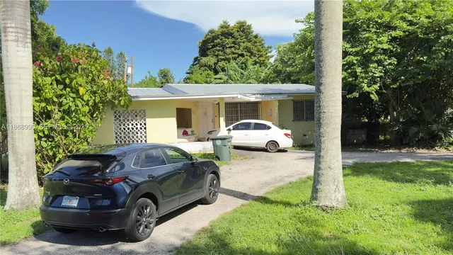 a car parked in front of a house
