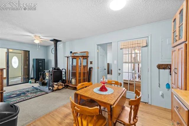 a view of a dining room with furniture and a window
