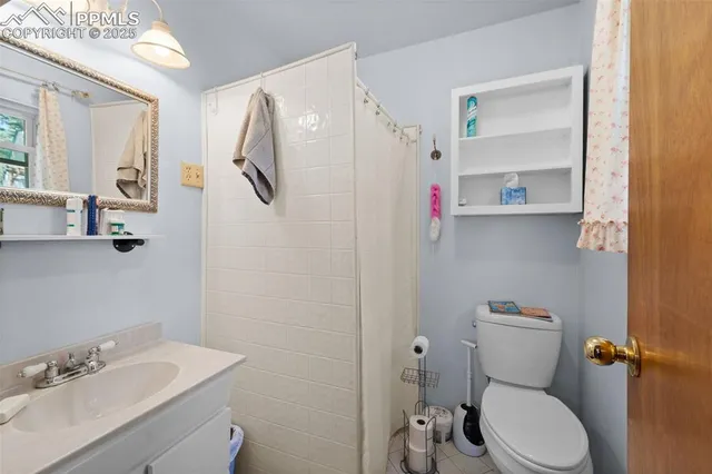 a bathroom with a sink toilet and vanity