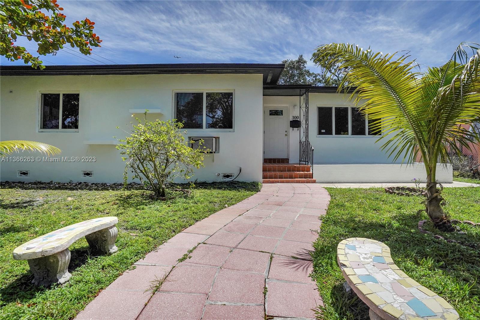 300 Northeast 48th Street Miami, FL 33137 - Photo 1 of 31 a front view of a house with garden