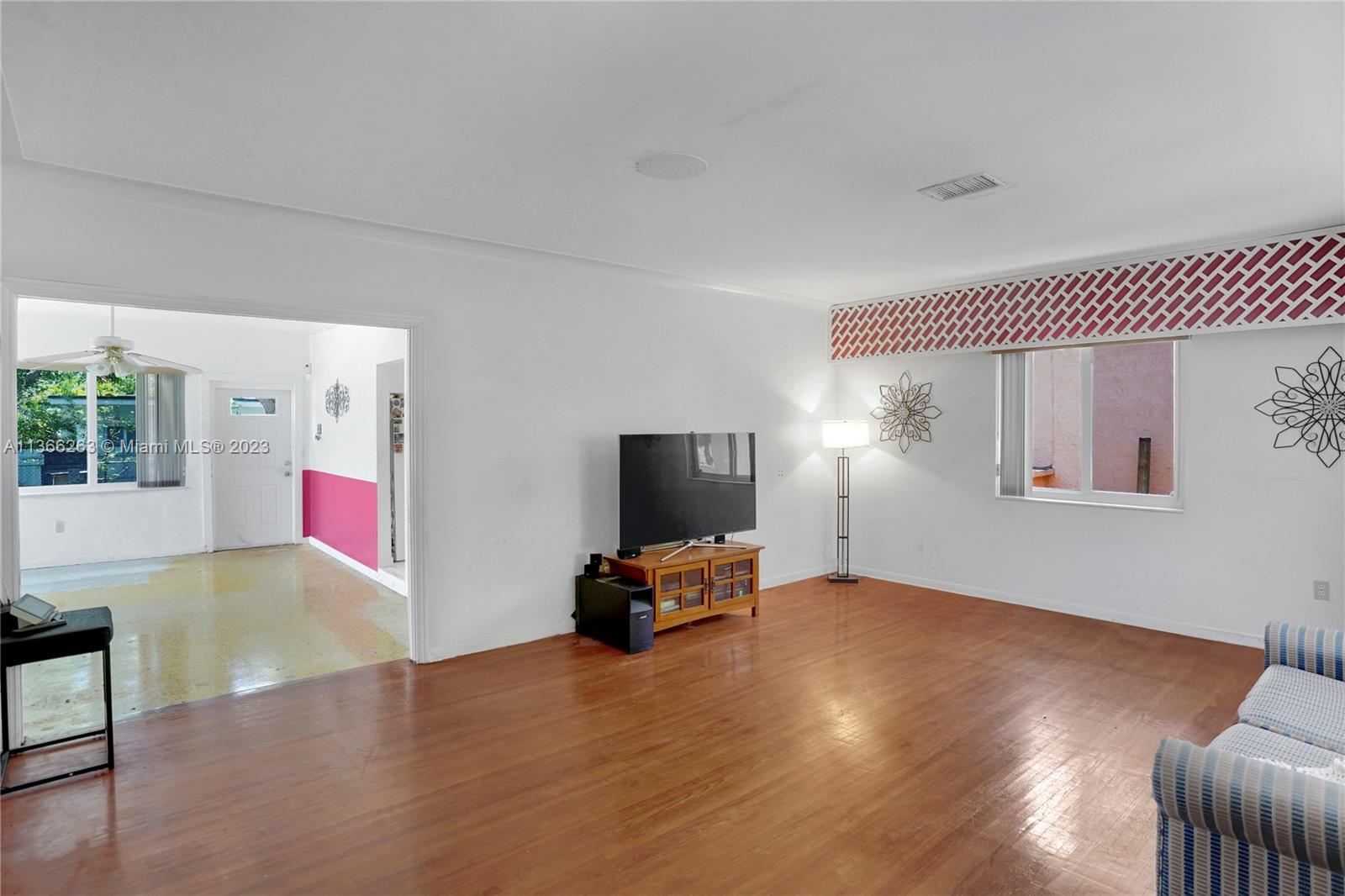 300 Northeast 48th Street Miami, FL 33137 - Photo 12 of 31 a living room with furniture and a flat screen tv