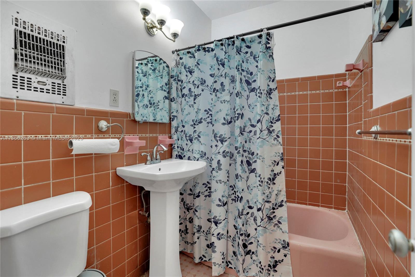 300 Northeast 48th Street Miami, FL 33137 - Photo 14 of 31 a bathroom with a sink a toilet and shower