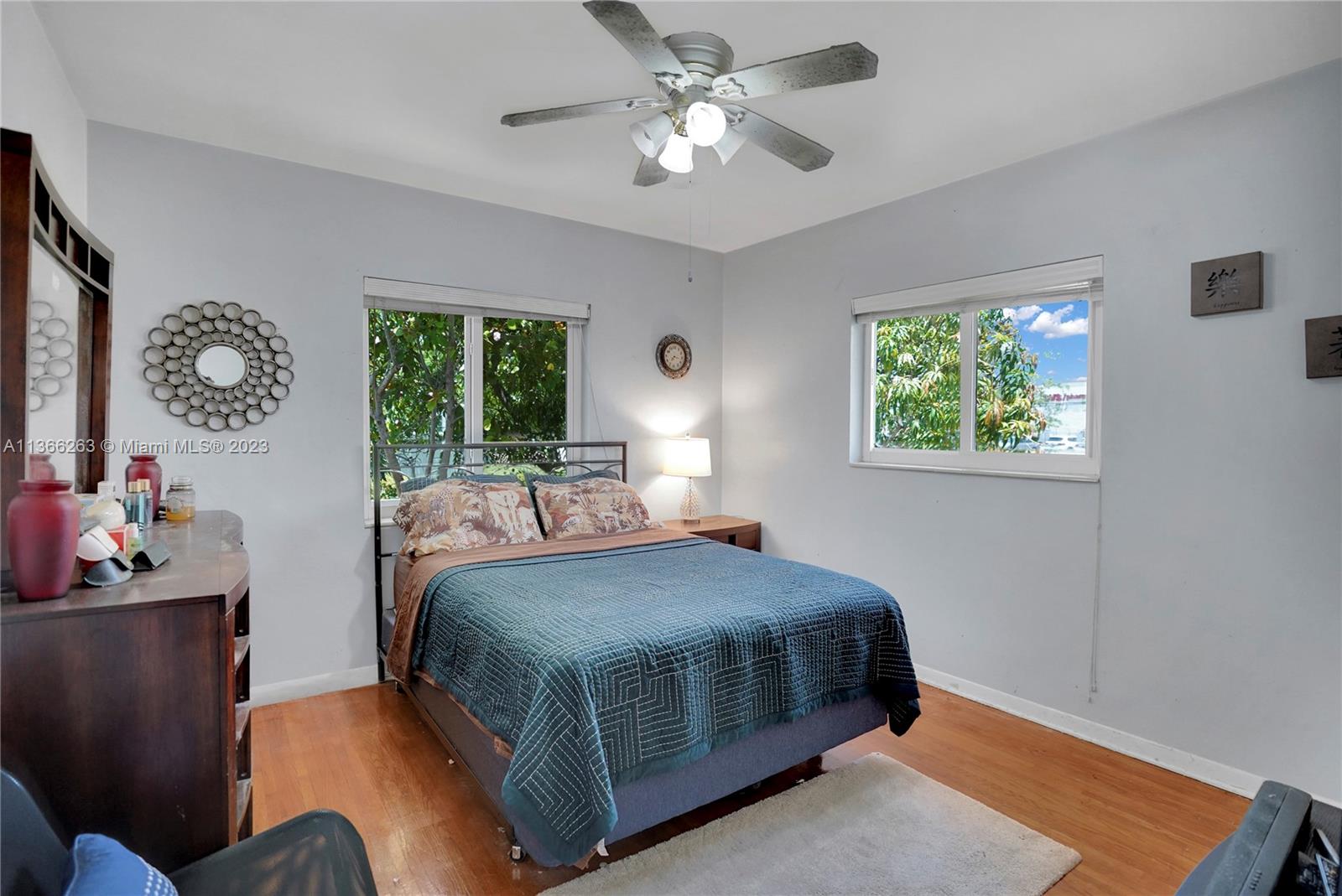 300 Northeast 48th Street Miami, FL 33137 - Photo 15 of 31 a bedroom with a bed and a chandelier