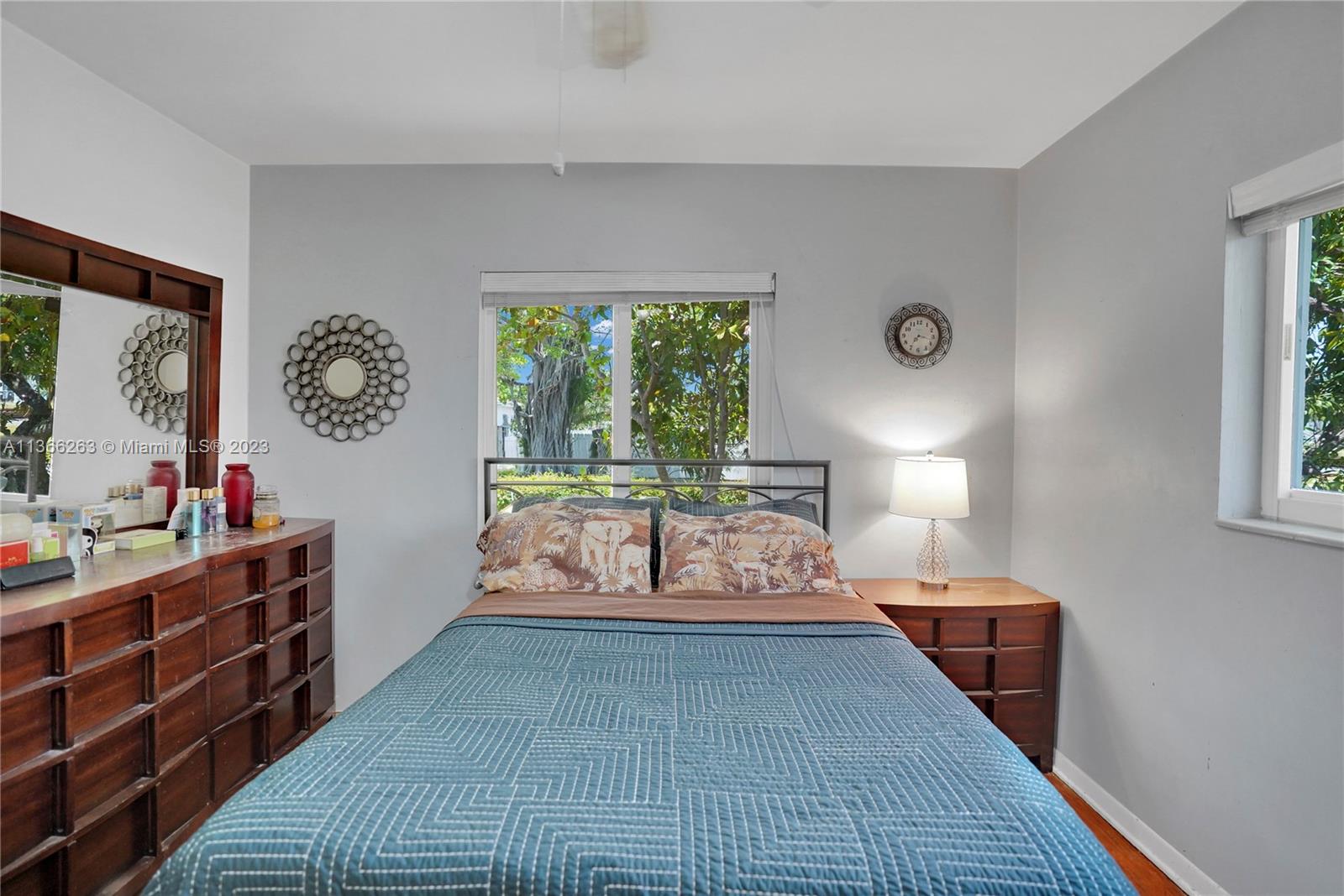 300 Northeast 48th Street Miami, FL 33137 - Photo 16 of 31 a bedroom with a bed and a lamp on dresser