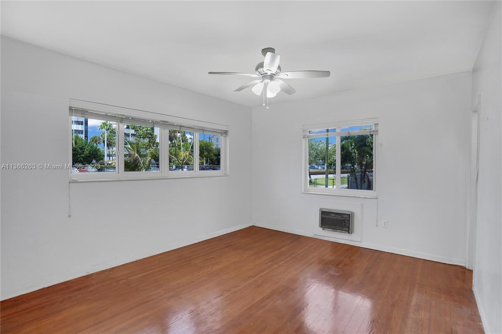 300 Northeast 48th Street Miami, FL 33137 - Photo 18 of 31 a view of empty room with wooden floor and fan