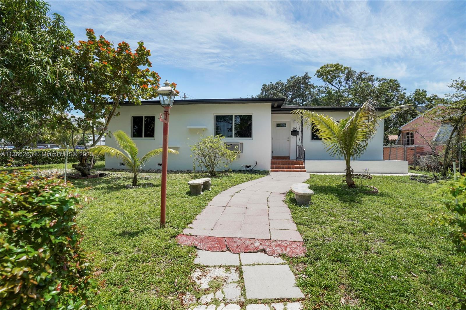 300 Northeast 48th Street Miami, FL 33137 - Photo 2 of 31 a front view of a house with garden