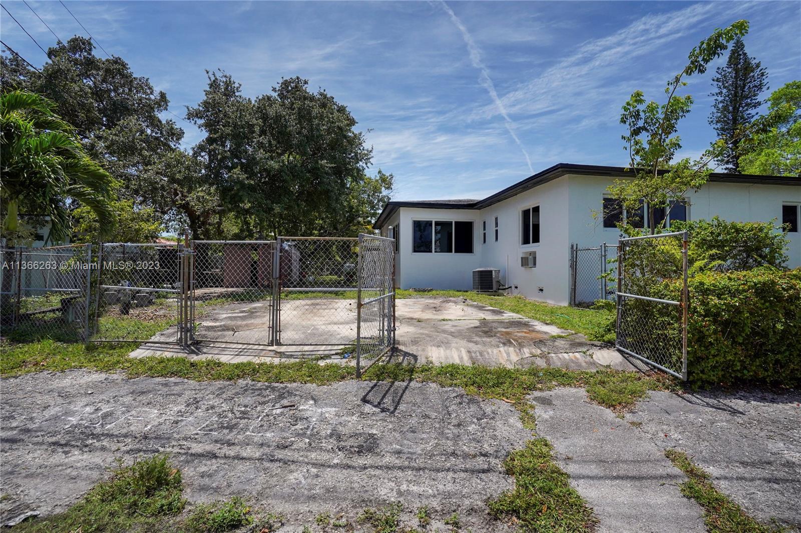 300 Northeast 48th Street Miami, FL 33137 - Photo 21 of 31 a view of a house with backyard and sitting area