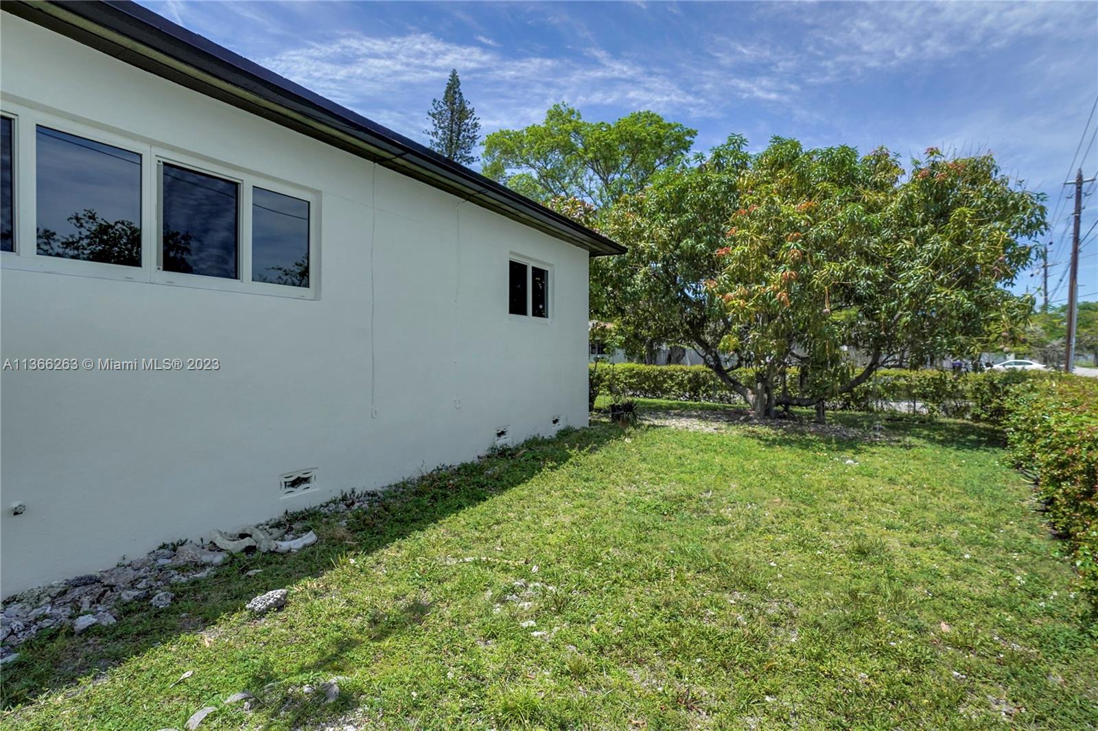 300 Northeast 48th Street Miami, FL 33137 - Photo 22 of 31 a backyard of a house with lots of green space