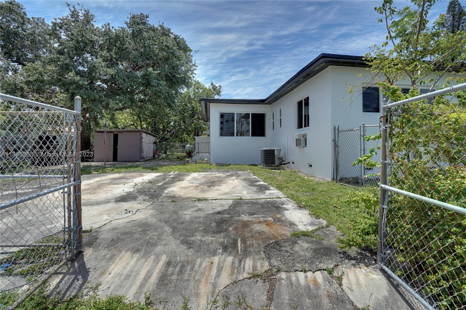 300 Northeast 48th Street Miami, FL 33137 - Photo 25 of 31 a view of a house with a yard and tree