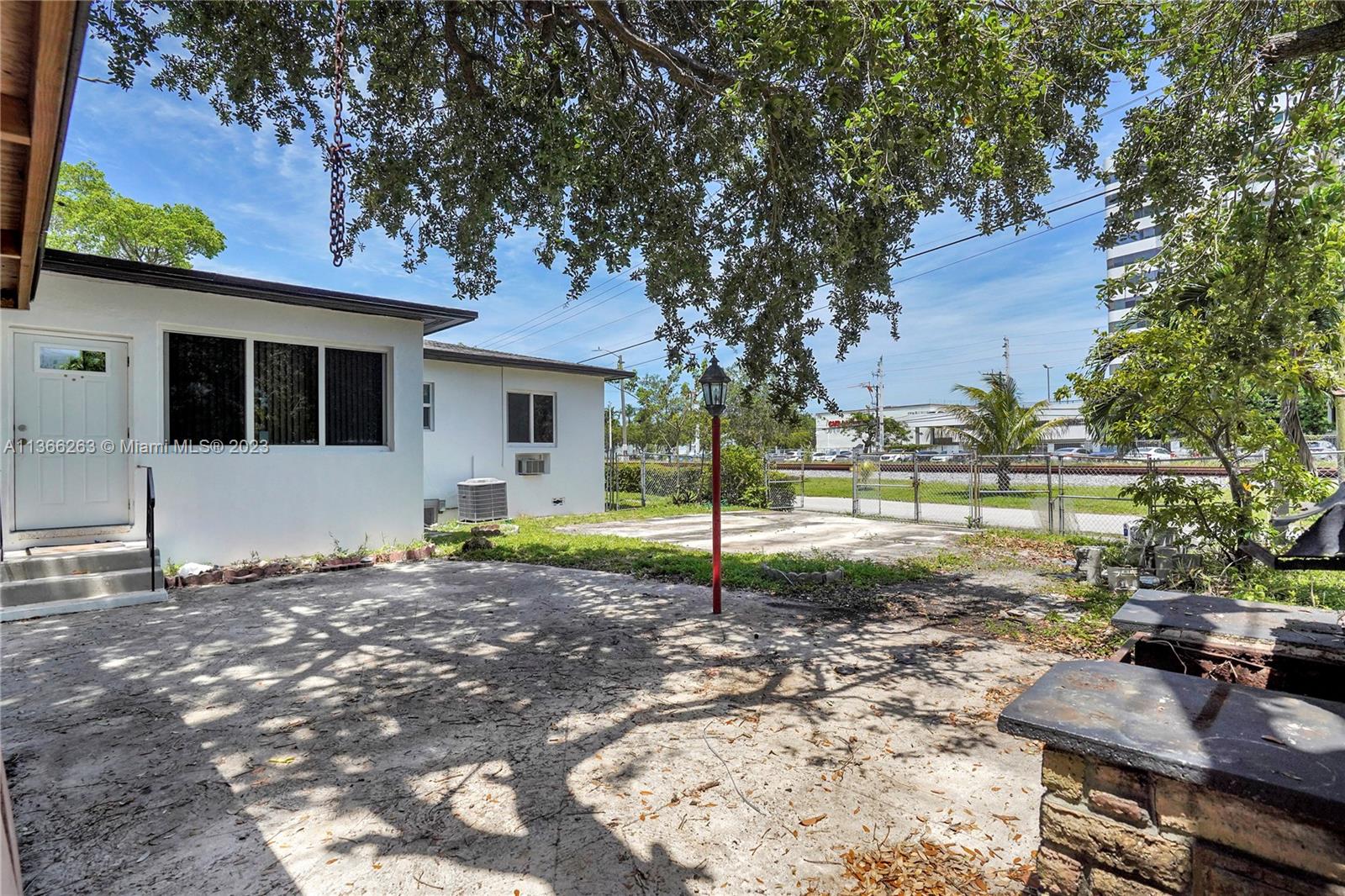 300 Northeast 48th Street Miami, FL 33137 - Photo 30 of 31 a view of a house with backyard and a tree