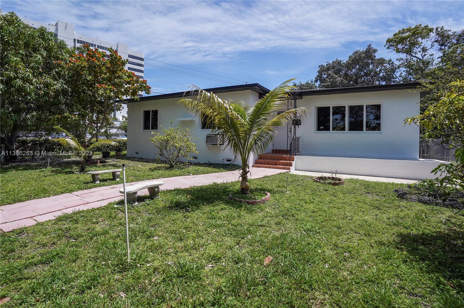 300 Northeast 48th Street Miami, FL 33137 - Photo 3 of 31 a front view of a house with a yard