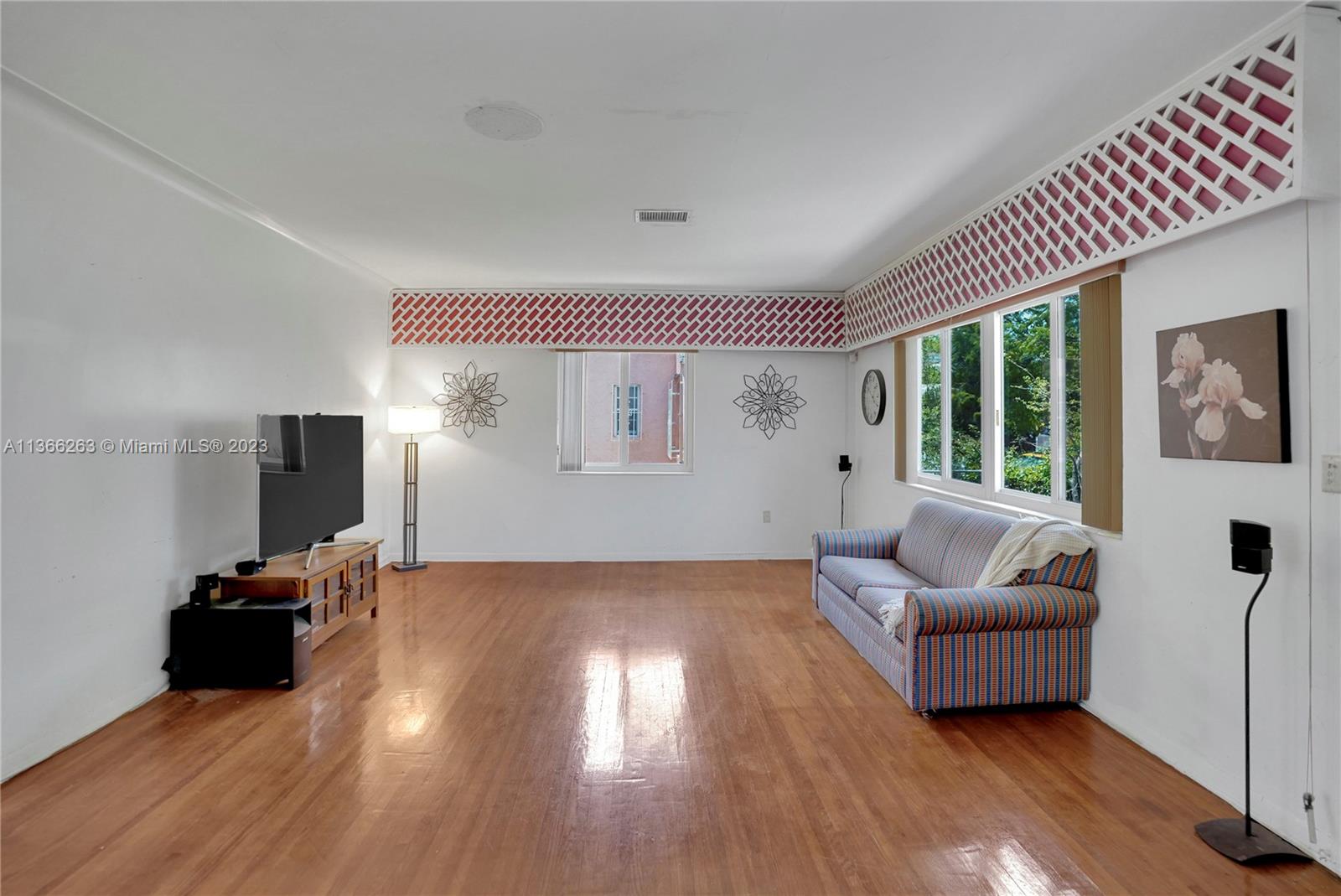300 Northeast 48th Street Miami, FL 33137 - Photo 8 of 31 a living room with furniture and a large window