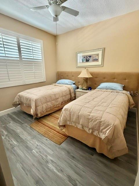 13413 Gasparilla Road, Unit 304 Placida, FL 33946 - Photo 22 of 28 a bedroom with two beds and a chandelier