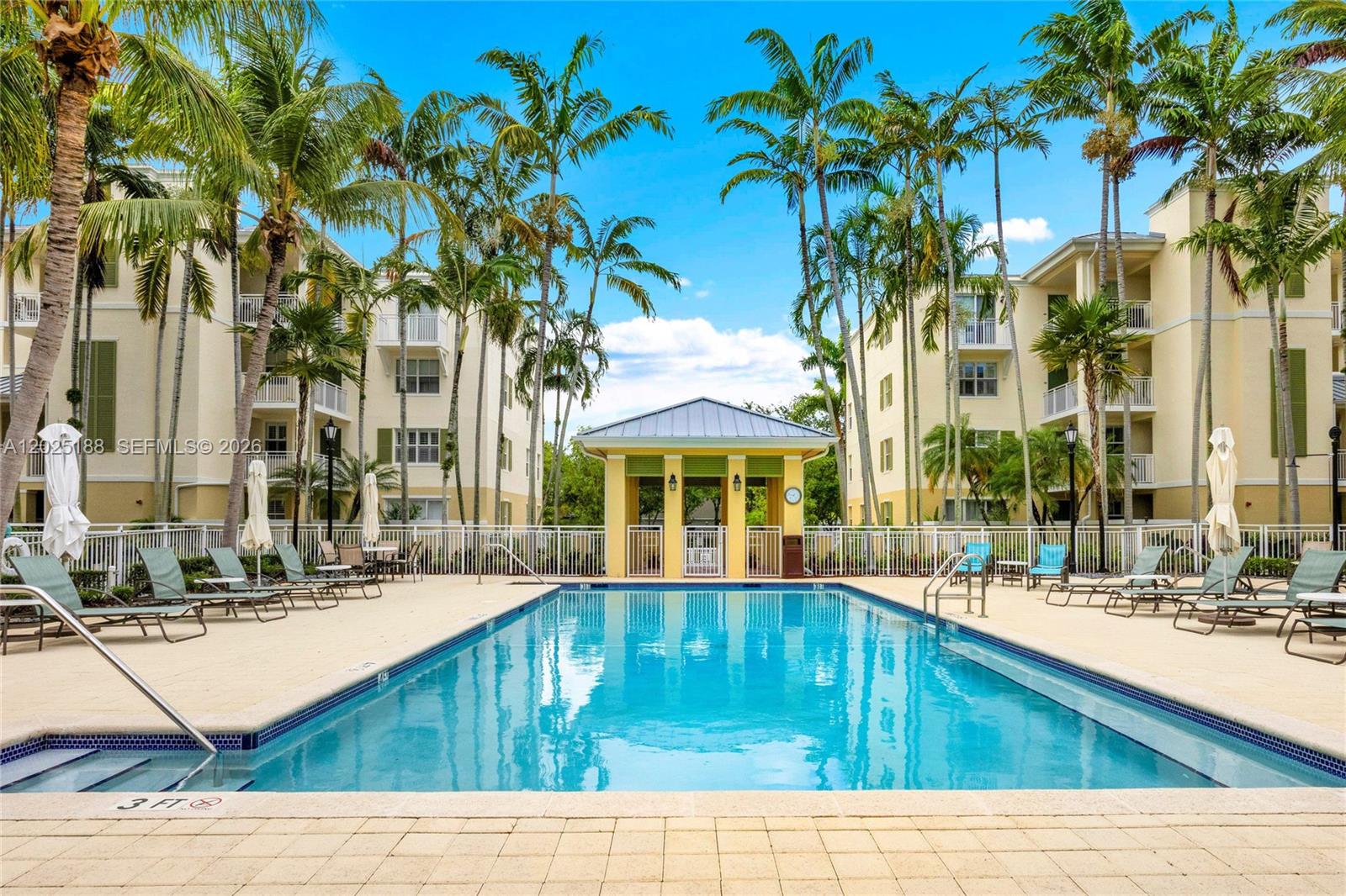 7620 Southwest 102nd Street, Unit 121 Pinecrest, FL 33156 - Photo 15 of 18 a swimming pool with outdoor seating and yard