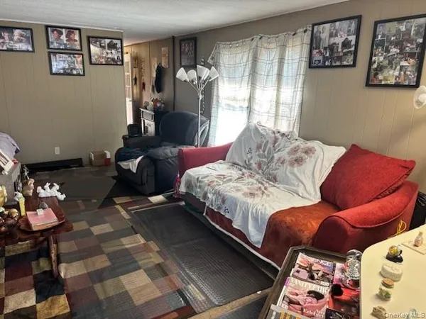 a bedroom with a bed and dresser