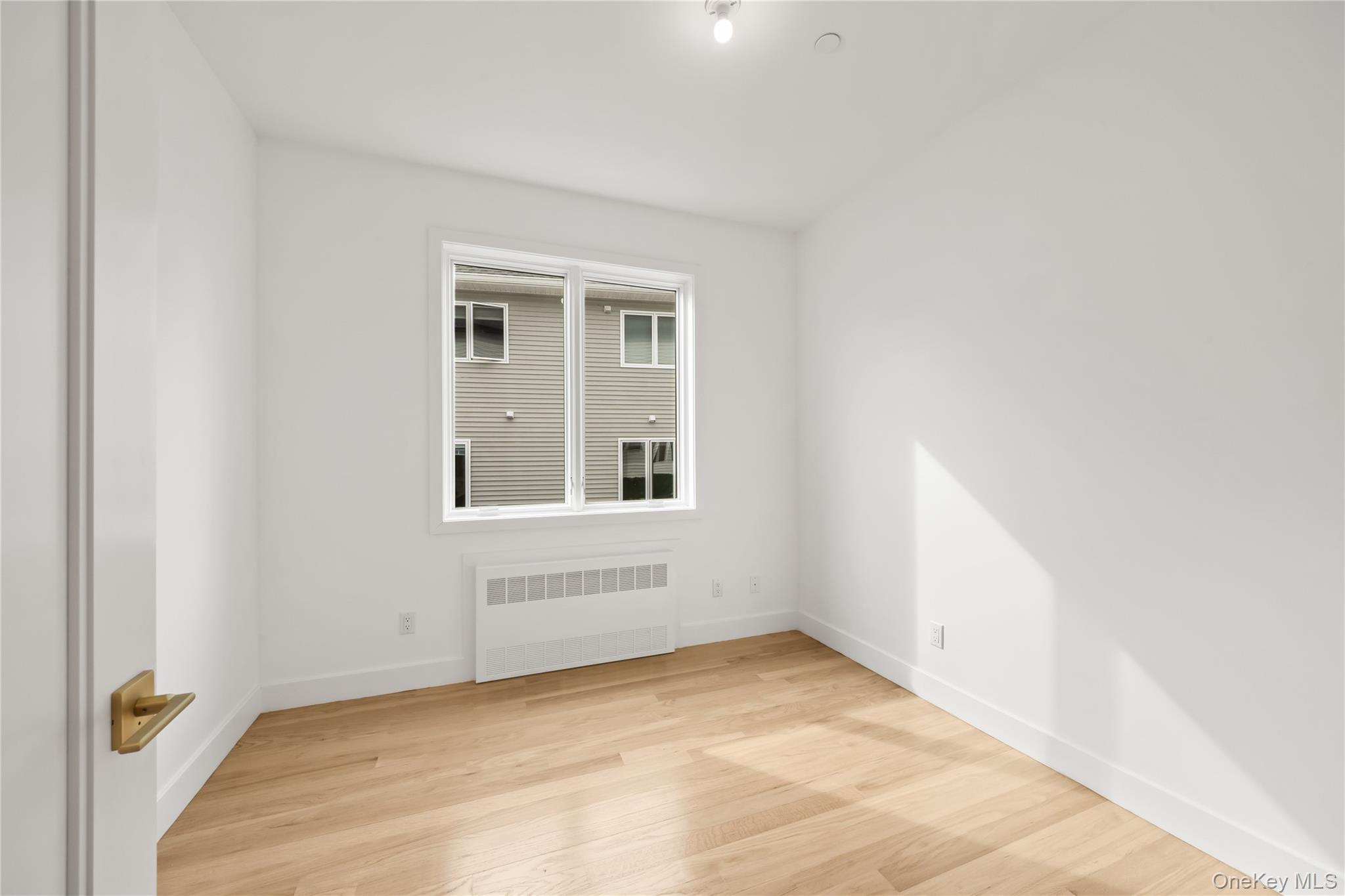 23 Singer Avenue, Unit 211 Spring Valley, NY 10977 - Photo 12 of 45 a view of an empty room with a window
